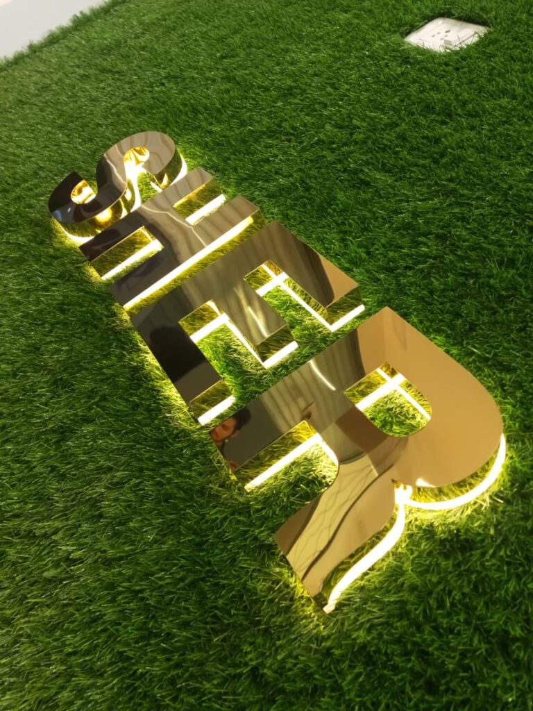 Backlight letter board with glowing illuminated text, providing a stylish, modern, and attention-grabbing signage display for branding.