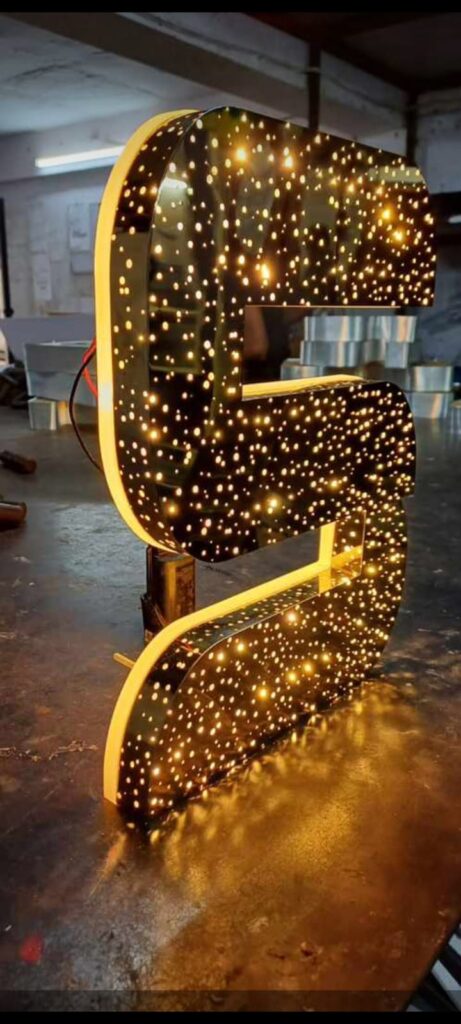 Illuminated steel letters with LED lighting, showcasing a modern, durable, and elegant signage design.